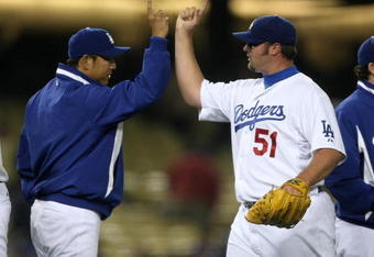 LOS ANGELES, CA - JUNE 03:  Closer Jonathan Broxton #51 and pitcher Hiroki Kuroda #18 of the Los Angeles Dodgers celebrate after the game against the Arizona Diamondbacks on June 3, 2009 at Dodger Stadium in Los Angeles, California.  Broxton pickup up his 13th save as the Dodgers won 1-0.  (Photo by Stephen Dunn/Getty Images)