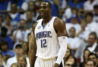 ORLANDO, FL - MAY 30: Dwight Howard #12 of the Orlando Magic looks on from the court against the Cleveland Cavaliers in Game Six of the Eastern Conference Finals during the 2009 Playoffs at Amway Arena on May 30, 2009 in Orlando, Florida. NOTE TO USER: User expressly acknowledges and agrees that, by downloading and or using this photograph, User is consenting to the terms and conditions of the Getty Images License Agreement  (Photo by Elsa/Getty Images)