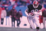 17 Dec 1989:  Tight end Ozzie Newsome of the Cleveland Browns runs with the ball as a Minnesota Vikings player chases him during a game at Cleveland Stadium in Cleveland, Ohio.  The Browns won the game, 23-17. Mandatory Credit: Rick Stewart  /Allsport