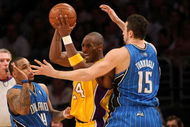 LOS ANGELES - JANUARY 16:  Kobe Bryant #24 of the Los Angeles Lakers looks to make a play to the basket against Jameer Nelson #14 and Hedo Turkoglu #15 of the Orlando Magic during their NBA game on January 16, 2009 at Staples Center in Los Angeles, California. The Magic won 109-103.   NOTE TO USER: User expressly acknowledges and agrees that, by downloading and/or using this Photograph, user is consenting to the terms and conditions of the Getty Images License Agreement. (Photo by Stephen Dunn/Getty Images)