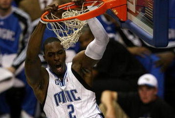ORLANDO, FL - MAY 30: Dwight Howard #12 of the Orlando Magic dunks the ball against the Cleveland Cavaliers in Game Six of the Eastern Conference Finals during the 2009 Playoffs at Amway Arena on May 30, 2009 in Orlando, Florida. NOTE TO USER: User expressly acknowledges and agrees that, by downloading and or using this photograph, User is consenting to the terms and conditions of the Getty Images License Agreement  (Photo by Doug Benc/Getty Images)