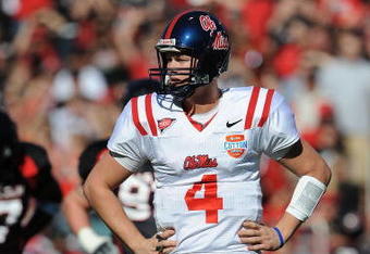 DALLAS - JANUARY 02:  Quarterback Jevan Snead #4 of the Mississippi Rebels drops back to pass against the Texas Tech Red Raiders during the AT&T Cotton Bowl on January 2, 2009 at the Cotton Bowl in Dallas, Texas.  (Photo by Ronald Martinez/Getty Images)