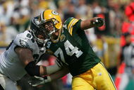 GREEN BAY, WI - SEPTEMBER 09: Aaron Kampman #74 of the Green Bay Packers rushes against Jon Runyan #69 of the Philadelphia Eagles on September 9, 2007 at Lambeau Field in Green Bay, Wisconsin. The Packers defeated the Eagles 16-13. (Photo by Jonathan Daniel/Getty Images)