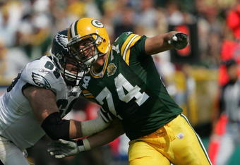 GREEN BAY, WI - SEPTEMBER 09: Aaron Kampman #74 of the Green Bay Packers rushes against Jon Runyan #69 of the Philadelphia Eagles on September 9, 2007 at Lambeau Field in Green Bay, Wisconsin. The Packers defeated the Eagles 16-13. (Photo by Jonathan Daniel/Getty Images)