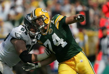 GREEN BAY, WI - SEPTEMBER 09: Aaron Kampman #74 of the Green Bay Packers rushes against Jon Runyan #69 of the Philadelphia Eagles on September 9, 2007 at Lambeau Field in Green Bay, Wisconsin. The Packers defeated the Eagles 16-13. (Photo by Jonathan Daniel/Getty Images)