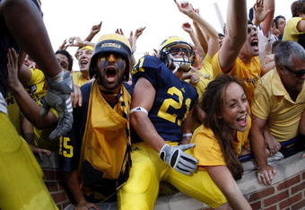ANN ARBOR, MI - SEPTEMBER 27:  Jordan Reilly #21 of the Michigan Wolverines and fans celebrate their victory over the Wisconsin Badgers on September 27, 2008 at Michigan Stadium in Ann Arbor, Michigan.  (Photo by Gregory Shamus/Getty Images)