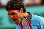 PARIS - JUNE 03:  Roger Federer of Switzerland celebrates victory during the Men's Singles Quarter Final match against Gael Monfils of France on day eleven of the French Open at Roland Garros on June 3, 2009 in Paris, France.  (Photo by Ryan Pierse/Getty Images)