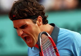 PARIS - JUNE 03:  Roger Federer of Switzerland celebrates victory during the Men's Singles Quarter Final match against Gael Monfils of France on day eleven of the French Open at Roland Garros on June 3, 2009 in Paris, France.  (Photo by Ryan Pierse/Getty Images)