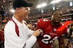 GLENDALE, AZ - JANUARY 18:  (L-R) Head coach Ken Whisenhunt of the Arizona Cardinals celebrates with safety Adrian Wilson #24 after winning the NFC championship game against the Philadelphia Eagles on January 18, 2009 at University of Phoenix Stadium in Glendale, Arizona. The Cardinals defeated the Eagles 32-25 to advance to the Super Bowl.  (Photo by Jamie Squire/Getty Images)