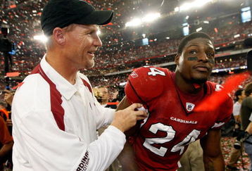 GLENDALE, AZ - JANUARY 18:  (L-R) Head coach Ken Whisenhunt of the Arizona Cardinals celebrates with safety Adrian Wilson #24 after winning the NFC championship game against the Philadelphia Eagles on January 18, 2009 at University of Phoenix Stadium in Glendale, Arizona. The Cardinals defeated the Eagles 32-25 to advance to the Super Bowl.  (Photo by Jamie Squire/Getty Images)