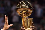 BOSTON - JUNE 17:  The Boston Celtics celebrate with the Larry O'Brien Trophy after defeating the Los Angeles Lakers in Game Five of the 2008 NBA Finals on June 17, 2008 at TD Banknorth Garden in Boston, Massachusetts. NOTE TO USER: User expressly acknowledges and agrees that, by downloading and/or using this Photograph, user is consenting to the terms and conditions of the Getty Images License Agreement.  (Photo by Elsa/Getty Images)