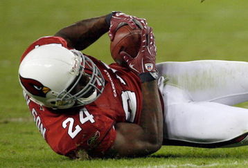 GLENDALE, AZ - NOVEMBER 10:  Adrian Wilson #24 of the Arizona Cardinals makes an interception against the San Francisco 49ers during the fourth quarter at University of Phoenix Stadium on November, 10 2008 in Glendale, Arizona.  (Photo by Harry How/Getty Images)