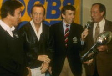 22 Jan 1984: Los Angeles Raiders head coach Tom Flores, Raiders owner Al Davis, Brent Musberger, and NFL Commissioner Pete Rozelle (l to r) at the presentation of the Lombardi Trophy after Super Bowl XVIII between the Los Angeles Raiders and the Washingto