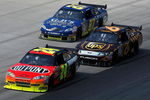 DOVER, DE - MAY 31:  Jeff Gordon, driver of the #24 DuPont Chevrolet leads David Ragan, driver of the #6 UPS Ford and Joe Nemechek, driver of the #87 Nemco Motorsports Toyota during the NASCAR Sprint Cup Series Autism Speaks 400 at Dover International Speedway on May 31, 2009 in Dover, Delaware.  (Photo by Nick Laham/Getty Images)