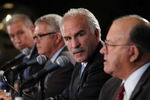 CHICAGO - OCTOBER 16:  Joel Quenneville (2nd-R) is introduced as the new head coach of the Chicago Blackhawks at a press conference on October 16, 2008 at the United Center in Chicago, Illinois. John McDonough, Blackhawks President (L), Dale Tallon (2nd-L), Blackhawks General Manager, and Scotty Bowman, Blackhawks Senior Advisor, Hockey Operations (R) attend. (Photo by David Banks/Getty Images)