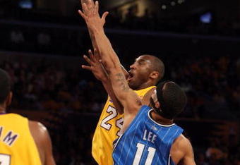 LOS ANGELES, CA - JUNE 04:  Kobe Bryant #24 of the Los Angeles Lakers shoots over Courtney Lee #11 of the Orlando Magic in the first quarter of Game One of the 2009 NBA Finals at Staples Center on June 4, 2009 in Los Angeles, California. NOTE TO USER: User expressly acknowledges and agrees that, by downloading and or using this photograph, User is consenting to the terms and conditions of the Getty Images License Agreement.  (Photo by Jed Jacobsohn/Getty Images)