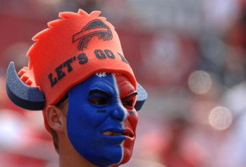 Buffalo Bills fan dressed in team colors watches play   against the Tampa Bay Buccaneers in the second quarter   September 18, 2005 in Tampa.  (Photo by Al Messerschmidt/Getty Images)