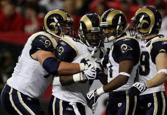 ATLANTA - DECEMBER 28:  Running back Steven Jackson #39 of the St. Louis Rams is congratulated by tackle Adam Goldberg #73, wide receivers Donnie Avery #17 and Dane Looker #89 after Jackson scored against the Atlanta Falcons at Georgia Dome on December 28, 2008 in Atlanta, Georgia.  (Photo by Doug Benc/Getty Images)