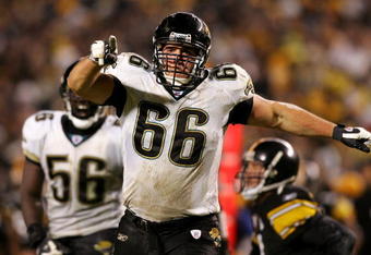 PITTSBURGH - JANUARY 05:  Derek Landri #66 of the Jacksonville Jaguars celebrates after sacking Ben Roethlisberger #7 of the Pittsburgh Steelers in the first half of the AFC Wild Card game on January 5, 2008 at Heinz Field in Pittsburgh, Pennsylvania.  (Photo by Jim McIsaac/Getty Images)