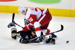 PITTSBURGH - JUNE 02:  Jiri Hudler #26 of the Detroit Red Wings fights for the puck against Maxime Talbot #25 of the Pittsburgh Penguins during Game Three of the 2009 NHL Stanley Cup Finals on June 2, 2009 at Mellon Arena in Pittsburgh, Pennsylvania.  (Photo by Jamie Sabau/Getty Images)