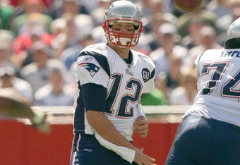 FOXBORO, MA - SEPTEMBER 7:  Quarterback Tom Brady #12 of the New England Patriots passes the ball up the middle during their NFL game against the Kansas City Chiefs on September 7, 2008 at Gillette Stadium in Foxboro, Massachusetts. The Patriots defeated the Chiefs 17-10. (Photo by Elsa Garrison/Getty Images)