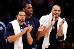 LOS ANGELES, CA - APRIL 27:  (lL-R) Deron Williams #8, Jarron Collins #31 and Carlos Boozer #5 of the Utah Jazz cheer on their team in the fourth quarter against the Los Angeles Lakers in Game Five of the Western Conference Quarterfinals during the 2009 NBA Playoffs at Staples Center on April 27, 2009 in Los Angeles, California. NOTE TO USER: User expressly acknowledges and agrees that, by downloading and or using this photograph, User is consenting to the terms and conditions of the Getty Images License Agreement.  (Photo by Kevork Djansezian/Getty Images)