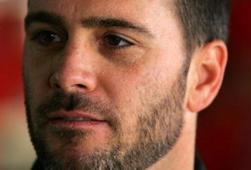 DOVER, DE - MAY 29:  Jimmie Johnson, driver of the #48 Lowe's/KOBALT Tools Chevrolet, stands in the garage during practice for the NASCAR Sprint Cup Series Autism Speaks 400 at Dover International Speedway on May 29, 2009 in Dover, Delaware.  (Photo by Chris Trotman/Getty Images)