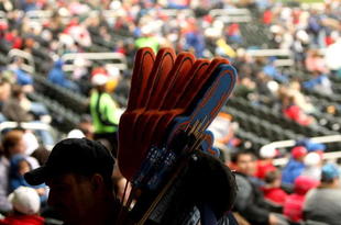 FLUSHING, NY - MARCH 29:  A vendor walks around the stadium selling large fingers during the Georgetown and St. Johns game at Citi Field on March 29, 2009 in the Flushing neighborhood of the Queens borough of New York City. This is the first event to be held at the new Citi Field.  (Photo by Ezra Shaw/Getty Images)