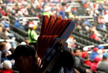FLUSHING, NY - MARCH 29:  A vendor walks around the stadium selling large fingers during the Georgetown and St. Johns game at Citi Field on March 29, 2009 in the Flushing neighborhood of the Queens borough of New York City. This is the first event to be held at the new Citi Field.  (Photo by Ezra Shaw/Getty Images)