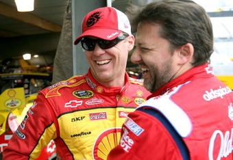 MARTINSVILLE, VA - MARCH 27:  Tony Stewart (R), driver of the #20 Old Spice/Office Depot Chevrolet, greets Kevin Harvick (L), driver of the #29 Shell/Pennzoil Chevrolet, during practice for the NASCAR Sprint Cup Series Goody�s Fast Pain Relief 500 at the Martinsville Speedway on March 27, 2009 in Martinsville, Virginia.  (Photo by Jerry Markland/Getty Images for NASCAR)