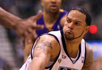 SALT LAKE CITY - APRIL 25:  Deron Williams #8 of the Utah Jazz passes against the Los Angeles Lakers in Game Four of the Western Conference Quarterfinals during the 2009 NBA Playoffs at Energy Solutions Arena on April 25, 2009 in Salt Lake City, Utah. NOTE TO USER: User expressly acknowledges and agrees that, by downloading and/or using this Photograph, user is consenting to the terms and conditions of the Getty Images License Agreement. Mandatory Copyright Notice: Copyright 2009 Getty Images (Photo by Otto Greule Jr/Getty Images)
