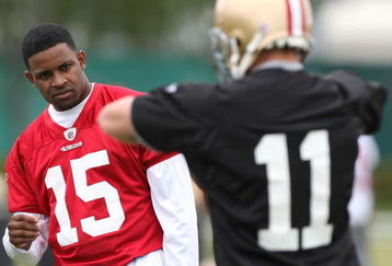 SANTA CLARA, CA - MAY 01:  Michael Crabtree #15 of the San Francisco 49ers looks on during practice as quaterback Alex Smith #11 practices during the 49ers Minicamp at their training facilities on May 1, 2009 in Santa Clara, California. Crabtree was the 49ers first round draft pick.  (Photo by Jed Jacobsohn/Getty Images)