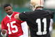 SANTA CLARA, CA - MAY 01:  Michael Crabtree #15 of the San Francisco 49ers looks on during practice as quaterback Alex Smith #11 practices during the 49ers Minicamp at their training facilities on May 1, 2009 in Santa Clara, California. Crabtree was the 49ers first round draft pick.  (Photo by Jed Jacobsohn/Getty Images)