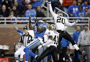 DETROIT - DECEMBER 21: Cornerback Randall Gay #20 of the New Orleans Saints breaks up the pass to Detroit Lions wide receiver Calvin Johnson #81 in the first quarter on December 21, 2008 at Ford Field in Detroit, Michigan. The Saints defeated the Lions 42-7.  (Photo by Leon Halip/Getty Images)