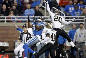 DETROIT - DECEMBER 21: Cornerback Randall Gay #20 of the New Orleans Saints breaks up the pass to Detroit Lions wide receiver Calvin Johnson #81 in the first quarter on December 21, 2008 at Ford Field in Detroit, Michigan. The Saints defeated the Lions 42-7.  (Photo by Leon Halip/Getty Images)