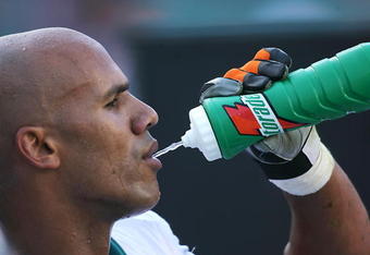 MIAMI - DECEMBER 2:  Jason Taylor #99 of the Miami Dolphins take a drink during the NFL game against the New York Jets at the Dolphin Stadium on December 2, 2007 in Miami, Florida. (Photo by Doug Benc/Getty Images)