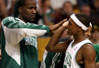 BOSTON - DECEMBER 03: Kendrick Perkins #43 of the Boston Celtics congratulates teammate Rajon Rondo #9 after Rondo was pulled from the game late in the fourth quarter against the Indiana Pacers on December 3, 2008 at TD Banknorth Garden in Boston, Massachusetts. The Celtics defeated the Pacers 114-96. NOTE TO USER: User expressly acknowledges and agrees that, by downloading and or using this Photograph, user is consenting to the terms and conditions of the Getty Images License Agreement. (Photo by Elsa/Getty Images)