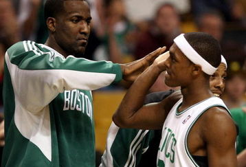 BOSTON - DECEMBER 03: Kendrick Perkins #43 of the Boston Celtics congratulates teammate Rajon Rondo #9 after Rondo was pulled from the game late in the fourth quarter against the Indiana Pacers on December 3, 2008 at TD Banknorth Garden in Boston, Massachusetts. The Celtics defeated the Pacers 114-96. NOTE TO USER: User expressly acknowledges and agrees that, by downloading and or using this Photograph, user is consenting to the terms and conditions of the Getty Images License Agreement. (Photo by Elsa/Getty Images)