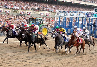 ELMONT, NY - JUNE 07:  Big Brown (R) ridden by jockey Kent Desormeaux and the field come out of the gate to start the 140th running of the Belmont Stakes at Belmont Park on June 7, 2008 in Elmont, New York.  (Photo by Al Bello/Getty Images)