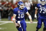 DETROIT - DECEMBER 5:  Quarterback Drew Willy #16 of the Buffalo Bulls scrambles as he looks to pass against the Ball State Cardinals during the MAC Championship game on December 5, 2008 at Ford Field in Detroit Michigan. (Photo by: Gregory Shamus/Getty Images)