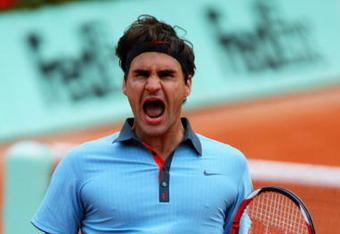 PARIS - JUNE 05:  Roger Federer of Switzerland celebrates victory during the Men's Singles Semi Final match against Juan Martin Del Potro of Argentina on day thirteen of the French Open at Roland Garros on June 5, 2009 in Paris, France.  (Photo by Matthew Stockman/Getty Images)