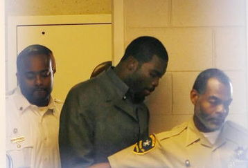 Sussex, VA - NOVEMBER 25:  Suspended Atlanta Falcons quarterback Michael Vick (C) leaves Surry County Circuit Court after entering a guilty plea on two felony counts connected to dog fighting on November 25, 2008 in Sussex, Virginia. Under a plea agreement, Vick, who is currently serving a term in prison for federal dog fighting charges, will serve one-year of probation for the state charges. He is scheduled to be released on July of 2009.  (Photo by Geoff Burke/Getty Images)