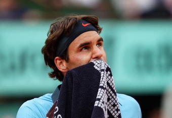 PARIS - JUNE 05:  Roger Federer of Switzerland looks on during the Men's Singles Semi Final match against Juan Martin Del Potro of Argentina on day thirteen of the French Open at Roland Garros on June 5, 2009 in Paris, France.  (Photo by Clive Brunskill/Getty Images)