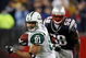 FOXBORO, MA - NOVEMBER 13:  Dustin Keller #81 of the New York Jets carries the ball in overtime as Pierre Woods #58 of the New England Patriots defends on November 13, 2008 at Gillette Stadium in Foxboro, Massachusetts. The Jets defeated the Patriots 34-31 in overtime.  (Photo by Elsa/Getty Images)