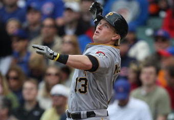 CHICAGO - MAY 27: Nate McLouth #13 of the Pittsburgh Pirates looses his bat as he swings against the Chicago Cubs on May 27, 2009 at Wrigley Field in Chicago, Illinois. The Cubs defeated the Pirates 5-2. (Photo by Jonathan Daniel/Getty Images) 