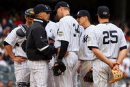 NEW YORK - MAY 17:  Manager Joe Girardi of the New York Yankees talks with A.J. Burnett #34 against the Minnesota Twins on May 17, 2009 at Yankee Stadium in the Bronx borough of New York City. The Yankees defeated the Twins 3-2 in ten innings.  (Photo by Jim McIsaac/Getty Images)