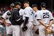 NEW YORK - MAY 17:  Manager Joe Girardi of the New York Yankees talks with A.J. Burnett #34 against the Minnesota Twins on May 17, 2009 at Yankee Stadium in the Bronx borough of New York City. The Yankees defeated the Twins 3-2 in ten innings.  (Photo by Jim McIsaac/Getty Images)