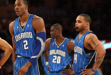 LOS ANGELES, CA - JUNE 04:  Dwight Howard #12  Jameer Nelson #14 and Mickael Pietrus #20 of the Orlando Magic look on during Game One of the 2009 NBA Finals against the Los Angeles Lakers at Staples Center on June 4, 2009 in Los Angeles, California. NOTE TO USER: User expressly acknowledges and agrees that, by downloading and or using this photograph, User is consenting to the terms and conditions of the Getty Images License Agreement.  (Photo by Jed Jacobsohn/Getty Images)