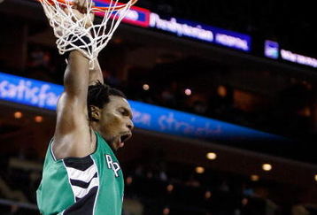 CHARLOTTE, NC - MARCH 16:  Chris Bosh #4 of the Toronto Raptors reacts after a dunk against Emeka Okafor #50 of the Charlotte Bobcats during their game at Time Warner Cable Arena on March 16, 2009 in Charlotte, North Carolina.  NOTE TO USER: User expressly acknowledges and agrees that, by downloading and/or using this Photograph, user is consenting to the terms and conditions of the Getty Images License Agreement.  (Photo by Streeter Lecka/Getty Images)