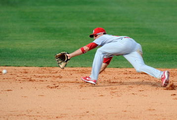 FORT LAUDERDALE, FL - FEBRUARY 26: Tyler Greene #67 of the St Louis Cardinals attempts to field a ground ball against the Baltimore Orioles during a spring training game at Fort Lauderdale Stadium on February 26, 2009 in Fort Lauderdale, Florida. (Photo by Rob Tringali/Getty Images)